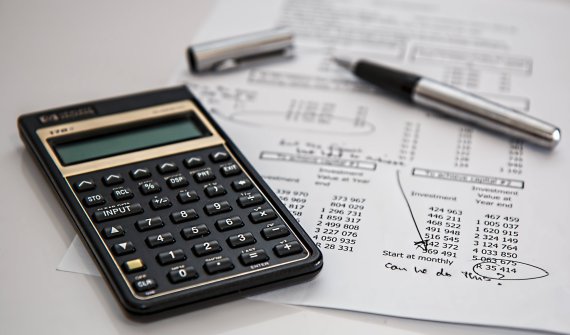 A calculator with bills and the question, Can we do this?