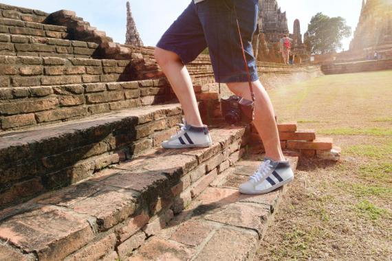 A man walking up steps.